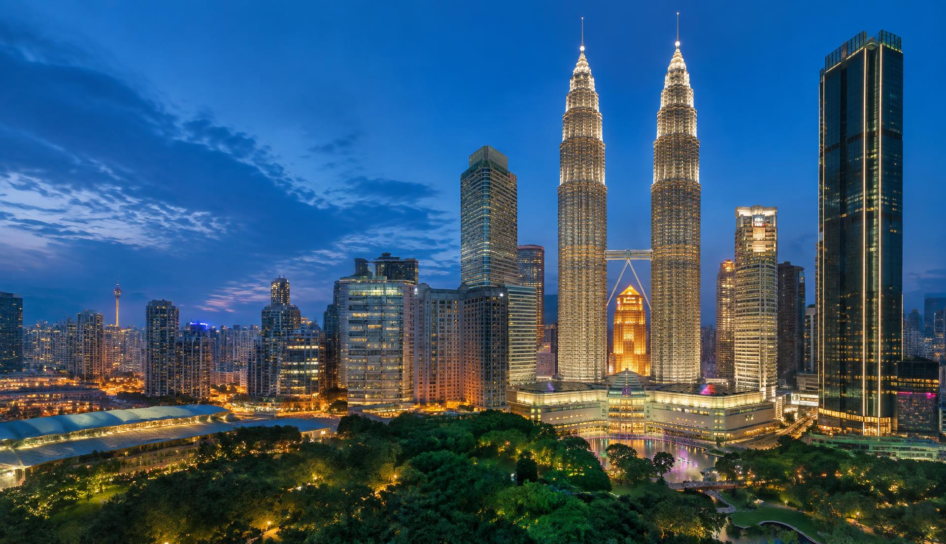 Petronas Twin Towers and Kuala Lumpur skyline at dusk
